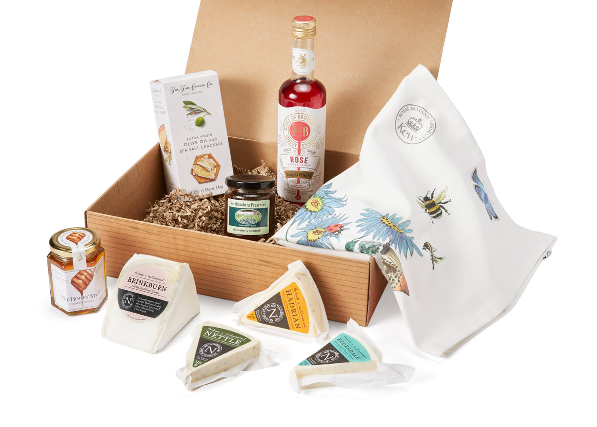 Hamper box with Brinkburn, Hadrian, Nettle and Redesdale wedges, honey, gooseberry chutney, crackers, rose syrup and a tea towel