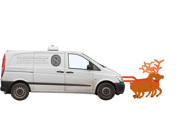 A Northumberland Cheese Company van harnessed to two cartoon reindeer