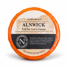 Alnwick Truckle 170g in orange wax, Wensleydale with mango and ginger, in its Northumberland Cheese Company label