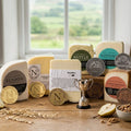 Elsdon, Chillingham Cheddar, EweMoo, Nettle, Redesdale and Chesterwood cheeses with show medals and a small silver trophy
