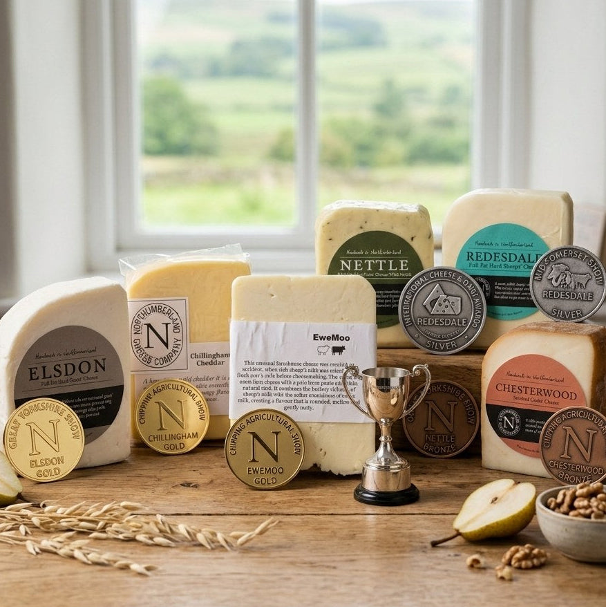 Elsdon, Chillingham Cheddar, EweMoo, Nettle, Redesdale and Chesterwood cheeses with show medals and a small silver trophy