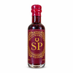 Small bottle of Blacksmiths SP, a blend of sloe gin and port wine, with a deep red and gold label and red wax seal
