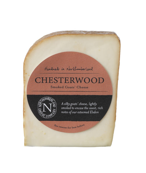 Chesterwood Smoked Goats Cheese 150g wedge with a russet smoked rind in its terracotta Northumberland Cheese Company label