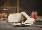 Chesterwood smoked goats' cheese with its russet rind, cut into wedges on a slate with apples, crackers and chutney