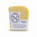 Wrapped 300g wedge of Chillingham Cheddar, labelled with the Northumberland Cheese Company logo and a short description