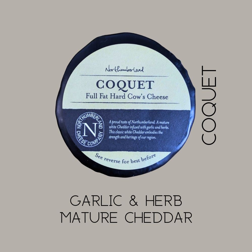 Coquet truckle on a grey background, captioned garlic and herb mature cheddar