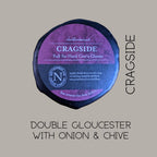 Cragside truckle on a grey background, captioned Double Gloucester with onion and chive