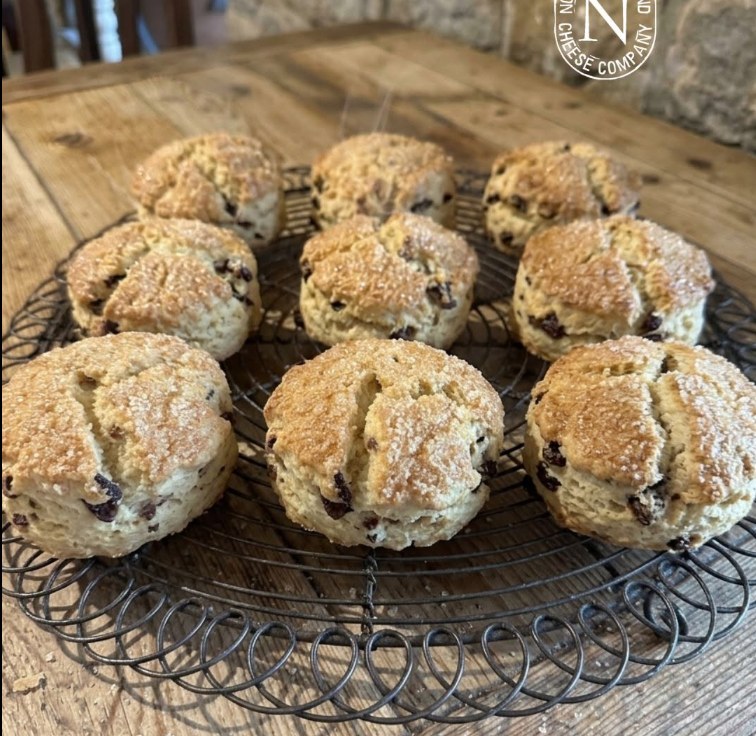 Freshly baked fruit scones cooling on a wire rack in the Cheese Loft Café