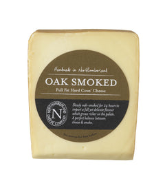 Oak Smoked Cheese wedge with a bronzed smoked rind in its olive brown Northumberland Cheese Company label