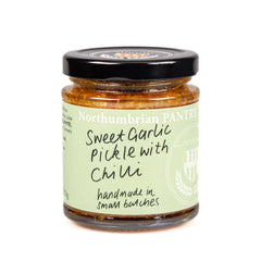 210g jar of Northumbrian Pantry Sweet Garlic Pickle with Chilli, with a sage-green hand-lettered label and black lid