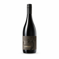 Bottle of Unruly Barossa Shiraz red wine with a dark label showing a gnarled old vine