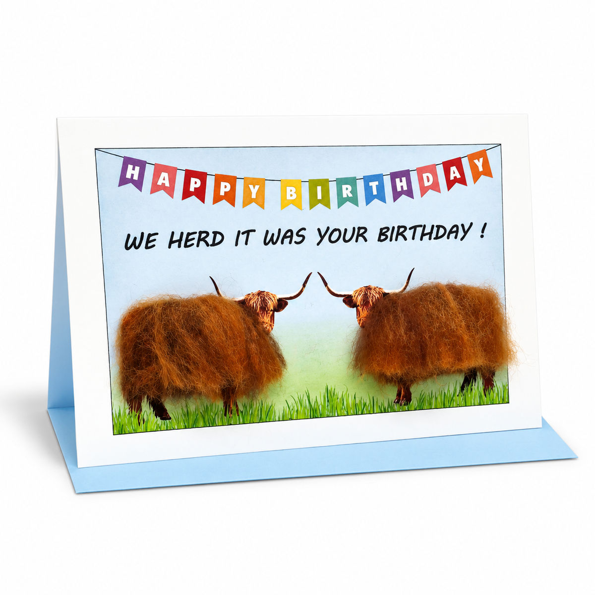 Birthday card reading 'We herd it was your birthday!' with two woolly Highland cows under colourful bunting
